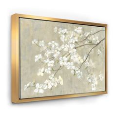 a painting with white flowers on it hanging on a wall next to a light fixture