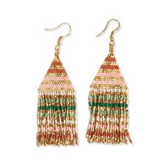 the multicolored fringe earrings are hanging from gold hooks