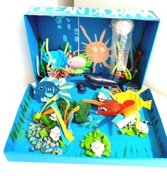 an open blue box filled with sea animals