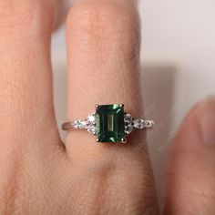 All HANDMADE ITEMS SHIP IN APPROX 8 DAYS Main Stone: Lab created green sapphire Main Stone Size: Emerald cut 6 mm x 8 mm Main Stone Weight: 1.75 carat Side Stone: CZs Height From The Ring Setting Bottom(to gemstone top): about 5.13 mm Width of Ring band Measure: gradually varied,about 1.67 to 1.91 mm Material: .925 Sterling Silver/14K White Gold/14K Yellow Gold/14k Rose Gold Engraved: Available For FreeNo more than 13 letters) Customized:Of course! Tell me what you want Includes With Order: All Formal Green Emerald Ring With Rectangular Stone, Formal Rectangular Green Emerald Ring, Fine Jewelry Sapphire Ring Emerald Cut For May Birthstone, Emerald Cut Sapphire Ring For May Birthstone, Rectangular Green Emerald Ring With Prong Setting, Emerald Cut Green Sapphire Ring For May Birthstone, Emerald Cut Green Sapphire Ring With Prong Setting, Rectangular Green Emerald Ring For Wedding, Fine Jewelry Green Emerald Cut Ring