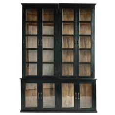 an old black bookcase with glass doors on the front and bottom shelves, isolated against a white background