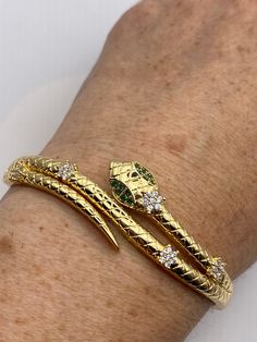 Vintage Snake Bangle Bracelet Gold filled Green Crystal Eyes
https://www.etsy.com/listing/1336074908/vintage-snake-bangle-bracelet-gold Flexible Gold Snake Bracelet, Gold Snake Shape Bracelet As Gift, Flexible Gold Bangle Bracelet As Gift, Flexible Gold Bangle Bracelet For Gift, Luxury Snake-shaped Bracelet Gift, Elegant Snake-shaped Bangle As Gift, Snake Shape Gold Bracelet Gift, Flexible Gold-plated Bangle As Gift, Luxury Snake-shaped Bracelet As Gift