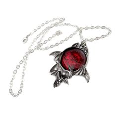 Looking for a piece of jewelry that will leave you mesmerized? Look no further than the Blood Moon Pendant. This stunning piece is a true masterpiece, featuring a skein of bats that flitters about a deep and sinister portent. The intricate design and impeccable quality of this pendant are sure to impress even the most discerning of customers. Crafted with the finest materials, the Blood Moon Pendant is a true work of art. Its approximate dimensions of Width 1.97" x Height 2.28" x Depth 0.39" mak Vampire King, Blood Red Moon, Dramatic Necklace, Ouroboros Snake, Flying Bats, Raven Pendant, Gothic Jewellery, Alchemy Gothic, Serpent Ring