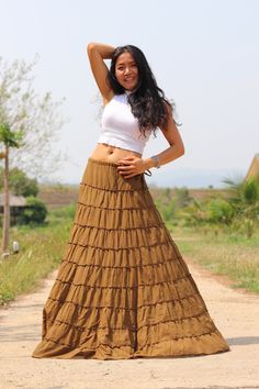 All items are shipped to Thailand Post . Free upgrade to D.H.L Express when you buy 2 or more items . The USA only. Please leave a phone number with orders. Full-length skirt in a beautiful soft cotton Boho style skirt with 10 tiers and 10 layers of ruffles all around and half lined. Drawstring waist with a small 7'' inch long zip. A great skirt to wear with a tight or cropped top. Easy to care for wash cold cycle, hang to dry or tumble dry low. Waist 33'' inches max ( drawstring ) Length 44'' i Spring Full Length Brown Skirt, Brown Full Length Skirt For Spring, Brown Full-length Skirt For Spring, Hippie Style Fitted Long Skirt, Hippie Fitted Long Skirt, Bohemian Brown Bottoms With Ruffles, Fitted Bohemian Brown Mini Skirt, Brown Full-length Lined Skirt, Full Length Fitted Bohemian Skirt