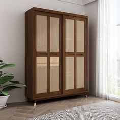 a large wooden cabinet sitting in front of a window next to a potted plant