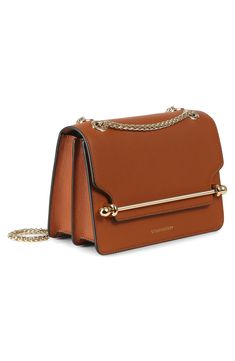 A gleaming bar closure brings signature style to a structured leather shoulder bag defined by its clean-lined silhouette and gleaming pull-through chain strap. Elegant and practical, the luxe look features an accordioned interior for effortless organization of the essentials. Slip-flap closure Pull-through chain strap Divided interior; wall pocket Structured silhouette with level base for stability Leather Made in Spain Designer Handbags Cognac Shoulder Bag With Metal Hardware For Evening, Evening Cognac Shoulder Bag With Palladium Hardware, Elegant Cognac Bags With Metal Hardware, Elegant Cognac Shoulder Bag With Chain Strap, Elegant Cognac Bag With Chain Strap, Versatile Shoulder Bag With Gold-tone Hardware And Top Handle, Strathberry East West, Formal Cognac Shoulder Bag With Silver-tone Hardware, Strathberry East West Mini