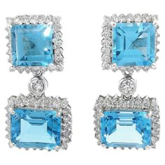 Embrace versatility and elegance with these captivating blue topaz earrings that can be worn as rectangular studs by removing the hanging blue topaz bits. Crafted with meticulous attention to detail, these earrings offer a stunning dual design, allowing you to effortlessly switch between two distinct looks. Designed in 18K white gold weighing 12.953g, these earrings exude a sense of luxury and refinement. The white gold setting beautifully complements the vibrant blue topaz, creating a harmoniou Elegant White Topaz Earrings Luxury, Luxury Blue Topaz Dangle Earrings, White Gold Set, Blue Topaz Earrings, Topaz Earrings, Swiss Blue Topaz, Diamond Stud, Elegant Accessories, Vibrant Blue