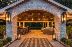 an outdoor living area is lit up at night