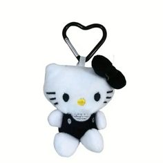 a hello kitty keychain with a black hat on it