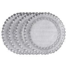 set of four placemats with silver beading on each side and an oval design in the middle