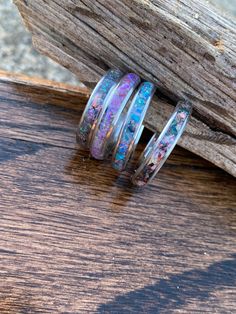 These rings are a great way to memorialize passed loved ones or pets by inlaying cremation ashes or locks of hair behind the inlay material. They can also be used as one of a kind wedding bands, school sprit rings, birthday rings. There are many colors and materials to chose from. Ring cores can be metal (silver or black) or exotic wood (wenge, Koa, Whiskey barrel, or Bocote) Inlay material can consist of opal, gemstones, mother of pearl or a number of materials. Price as stated is base price wh Sterling Silver Keepsake Rings, Silver Keepsake Ring, Anniversary Opal Ring With Natural Inclusions, Angel Wings Wall Decor, Ash Jewelry, Memorial Jewelry Ashes, Cremation Ring, Jewelry Wood, Multiple Rings