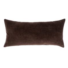 a brown velvet pillow on a white background