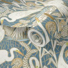 a blue and gold wallpaper with white birds on it's back drop down