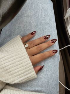 obsessed with these bow nails! Bow Nails For Christmas, Minimal Christmas Nails Short, Red Chrome Nails With Bow, Dark Red Nails With Bow, Burgundy Nails Christmas, White Nails With Red Bow, Chrome Nails With Bow, Lowkey Christmas Nails, Winter Bow Nails