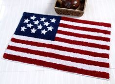 an american flag rug next to a basket of apples