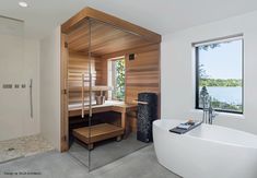 a bathroom with a large tub and wooden walls