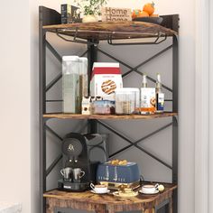 a shelf with coffee cups and other items on it in the corner of a room