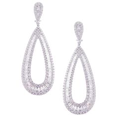 These simple baguette pear earrings are crafted in 18-karat white gold, weighing approximately 15.08 total carats of SI-V Quality white diamond. French Clip backing, 3" inches tall. Our Simple Baguette Collection feature earrings for those with simple aesthetics and classy tastes. 256 Round Diamonds = 8.55 ct 141 Baguette Diamonds = 6.53 ct Pear Earrings, Simple Diamonds, Diamond Dangle Earrings, Pearl Earrings Dangle, Antique Earrings, Gold Earrings Dangle, Gems Jewelry, Baguette Diamond, Heart Earrings