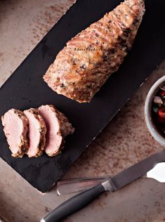 sliced meat and vegetables on a cutting board