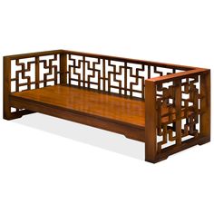 a wooden bench with an intricate design on the top and bottom part, sitting against a white background