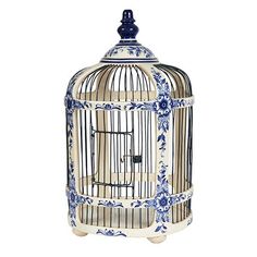 a blue and white birdcage with an ornate design on the top, sitting in front of a white background