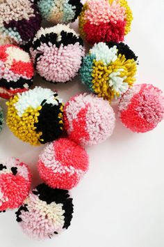 several different types of pom - poms on a white surface