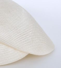 "\"Lou\" is a light cap with a sophisticated lateral fold and a small shield. The slider cap made of the unbleached straw of the Agave is pleasantly air-permeable and very light. The woven type Parasisol results in a fine \"herringbone\" pattern. A hat band sewn in by hand with an invisible stitch ensures a perfect fit and a noble look. I manufacture the cap in the colour \"nature\". The peaked cap can be combined to elegant and sporty outfits. The design is timelessly beautiful, equally perfect Elegant Beige Flat Cap, Adjustable Beige Sinamay Straw Hat, Cream Sinamay Hat For Summer, Elegant White Woven Hat, Beige Sinamay Hat For Summer, Elegant White Woven Sun Hat, Summer Beige Sinamay Hat, Elegant Cream Woven Straw Hat, Elegant White Woven Straw Hat