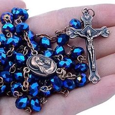 Blue Crystal Beads Rosary Catholic Deep Blue Crystal Beads Rosary Vintage design metal Cross Crucifix long beaded necklace with Jerusalem Holy soil medallion In The Middle. Cross (H X W) : 4 cm x 2.5 cm / 1.6" x 1" Catholic Rosary necklace fit for an adult with a perfect chain length of 18", Customized Gift Velvet Bag. The Rosary necklace chain and the crucifix are made of zinc and coated with silver, preventing corrosion and never turning black. Communion rosary connected to devout 59 beads per Black Rosary Necklace, Black Rosary, Blue Rosary, Blue Crystal Beads, Rosary Jewelry, Rosary Beads Catholic, Catholic Necklace, Gold Rosary, Faith Jewelry