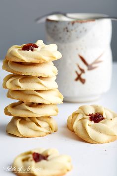 a stack of cookies sitting on top of a white table