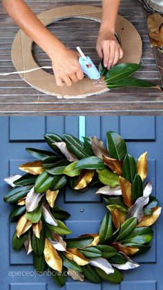 someone is making a wreath out of fake leaves and glues it on the front door