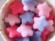 small pink and blue sugar stars in a white bowl