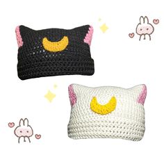 two crocheted pillows with faces and ears on them, one is black and the other is white