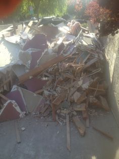 a pile of rubble sitting on top of a sidewalk