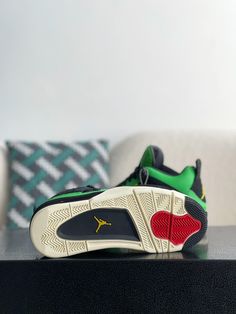 Embrace exclusivity with these Air Jordan 4 Retro "Manila"-inspired sneakers. This legendary colorway, originally a regional exclusive, is reimagined with meticulous attention to detail. The vibrant green upper, crafted from suede and textured leather, delivers a luxurious look and feel. The iconic silhouette, complete with signature mesh netting and a visible Air unit, ensures both classic style and all-day comfort. Step into sneaker history with these ultra-rare, head-turning kicks. Fall Winter Jacket, Mesh Netting, Jordan 4 Retro, Air Jordan 4, Air Jordan 4 Retro, Loafer Sneakers, Bottega Veneta Shoulder Bag, Vibrant Green, Manila