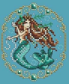 a cross stitch pattern of a mermaid holding a fish