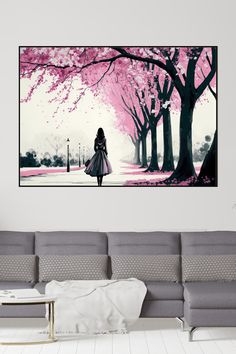 a woman is walking down the street with pink trees