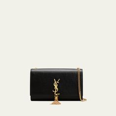 Saint Laurent crossbody bag in calf leather. Chain shoulder strap, 19" drop. Can be worn over the shoulder or across the body. Flap top with YSL logo medallion tassel. Golden hardware Interior wall pocket and six card slots. Approx. 6"H x 9.5"W x 2.25"D. Item weight, 1 lb. "Kate" is made in Italy. Classic Evening Wallet On Chain With Logo Plaque, Elegant Evening Wallet On Chain With Logo Plaque, Elegant Wallet On Chain With Logo Plaque, Evening Bags With Logo Charm, Luxury Formal Bags With Logo Charm, Chic Evening Bags With Logo Charm, Elegant Evening Bag With Logo Charm, Saint Laurent Crossbody Bag, Ysl Wallet On Chain