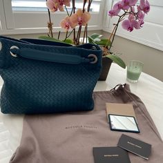 Authentic Bottega Veneta Bag. The Top Is Open To A Brown Suede Interior With Zipper And Patch Pockets. One Strap Can Be Pulled Up So The Bag Is Cinched And Become A Shoulder Bag. Comes With Pocket Mirror Leather On Back With Embossed Bottega Veneta On Back. It Is A Perfect Everyday Shoulder Bag/Tote Color Deep Aqua Base Length: 13 In Height: 10.5 In Width: 5.25 In Drop: 6 In Elegant Bags With Intrecciato Weave For Daily Use, Elegant Intrecciato Weave Bag For Daily Use, Elegant Daily Use Bag With Intrecciato Weave, Evening Blue Shoulder Bag With Leather Handles, Formal Satchel Bag With Intrecciato Weave, Formal Blue Bags With Leather Handles, Designer Bags With Intrecciato Weave For Daily Use, Designer Bags With Intrecciato Weave For Formal, Elegant Handheld Bag With Intrecciato Weave