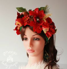 a mannequin head wearing a red flower crown