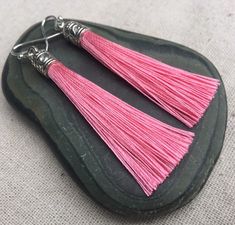 "Chic pink tassel earrings! They would add a pop of color to any outfit for any occasion. Dress them up or down. They are timeless and versatile. They are lightweight, fun and unique! The tassels measure 2 1/8\" long by 1/4\" wide. They hang from simple silver ear wire hooks. Overall drop length is about 2 1/4\". Metal is allergy free plated silver. These are my latest creation! I have them available in many colors! Find them all under the category tassel earrings in my shop. Thanks for stopping Pink Tassel Earrings As Gift, Pink Tassel Earrings For Gift, Pink Dangle Tassel Earrings For Gifts, Acorn Jewelry, Pink Statement Earrings, Green Tassel Earrings, Pink Tassel Earrings, Gifts Pink, Lover Jewelry