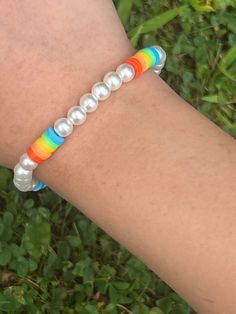 This is a beautiful,rainbow bracelet Rainbow Bangle Jewelry With Colorful Beads, Trendy Rainbow Friendship Bracelets For Everyday, Trendy Everyday Rainbow Friendship Bracelets, Everyday Bohemian Rainbow Bracelets, Trendy Rainbow Round Beads Bracelets, Trendy Rainbow Bracelets With Round Beads, Rainbow Beaded Stretch Bracelet, Rainbow Casual Bracelets For Everyday, Trendy Rainbow Beaded Bracelet