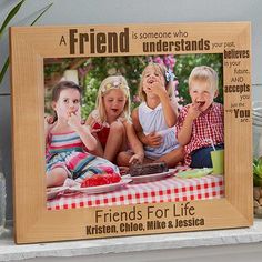 a family picture frame with the words friends for life and three children sitting on a picnic table