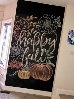 a chalkboard with the words happy fall written on it