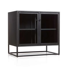 a black cabinet with glass doors and metal legs