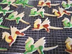 some decorated cookies are on a cooling rack