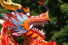 a colorful dragon head on display at a carnival