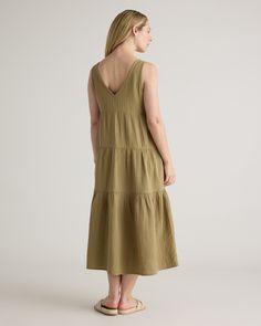 The ultimate slip on and step out style, this easy-to-wear dress still packs a fashionable punch. Made of breezy, lightweight organic cotton gauze, it features a v-neck in the front and back and flowy tiered bodice. Slide into a pair of sandals and top with a few pieces of jewelry and you’ve got a full look.  | Quince | Women's Gauze Tiered Maxi Dress in Artichoke, Size Large, Organic Cotton Casual V-neck Linen Dress For Brunch, Breezy V-neck Loungewear Dress, Relaxed Fit V-neck Sundress Midi Dress, Breezy V-neck Midi Dress For Daywear, Casual Summer V-neck Dress With Relaxed Fit, Casual V-neck Dress With Relaxed Fit For Summer, Breezy Linen V-neck Dress, Relaxed Fit V-neck Maxi Sundress, Summer V-neck Midi Dress Relaxed Fit