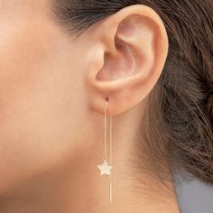 "Details Handmade item Material: 14K Solid Gold Style: Minimalist Gold Color Options: Yellow Gold | White Gold | Rose Gold Recycled Made to Order The Earring Details 14K Solid Gold Gold Color Options: 14K Solid Yellow /Rose /White Gold Total Lenght: 5,5 cm Chain Part Lenght: 5 cm Star Part Lenght: 4cm Star Lenght: 1 cm Star Thickness: 0,45 mm 🎁 All of your jewellery is sent with the certificate of product in a specially designed PIANO gift box. 🛠 Piano Jewellery products are handcrafted by 30-45 years of experienced craftsmen and made to order. ✈ Ready to ship in 3 - 5 business days. FREE shipping worldwide. 🌎 Customs Duty Fees; since the various customs tax fees of every country may occur extra tax fees belong to the customer 🎁 All of your jewellery is sent with the certificate of pro Gold Drop Earrings With Star Charm, Dainty Yellow Gold Earrings With Star Charm, Dainty Yellow Gold Star Charm Earrings, Yellow Gold Star Charm Drop Earrings, 14k Gold-filled Star Earrings, Piano Gifts, Dainty Gold Earrings, Earrings Double, Gold Water