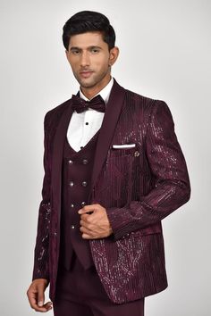 Wine shimmer tuxedo with sequin embroidery all over. Paired with a waistcoat, pant, shirt and bow tie.
Components: 5
Pattern: Embroidered
Type Of Work: Sequin
Neckline: Lapel collar
Sleeve Type: Long
Fabric: Crepe, Handloom Silk, Terry Rayon
Color: Wine
Other Details: 
Note: Pocket square worn by the model and outfit worn by the model on the left is not for sale.
Occasion: Cocktail and Reception - Aza Fashions Rohit Bal, Tuxedo Pants, Tarun Tahiliani, Sequin Embroidery, Buy Wine, Tuxedos, Sequins Embroidery, Pant Shirt, Pant Set