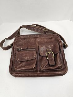 Fossil Brown Leather Briefcase Laptop Tablet travel Satchel work school tote bag 14" wide, 12" tall, 2.5-3" deep  Please measure your laptop or tablet to ensure it will fit, I would suggest 13" wide should fit fine, my laptop is 15" wide and it is too large by 1.5" to 2". Vintage Preowned in great condition.  Well conditioned and cared for.  See pictures for clear condition details.  Zippers all work, satchel strap works, all buttons/snaps work, no stains, no rips/tears. B1 Tote Bags For School, School Tote, My Laptop, Franklin Tn, Leather Briefcase, Tablet Laptop, Purses And Handbags, Fossil, Brown Leather